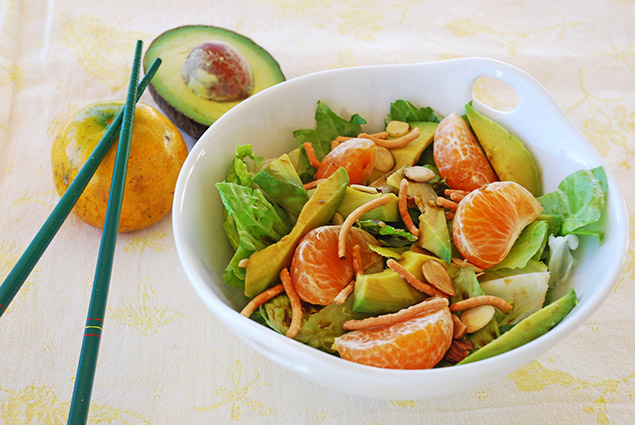 a fresh salad with avocado, Florida tangerines, and almonds